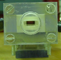  Back of the gun showing the 1" thick injector backplate which adapts a 3/4" thread to feed the 1/4" x 0.6" bore of the gun